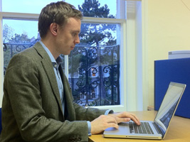 Chris Tyler working at his laptop