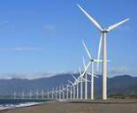 A row of wind turbines on a beach