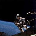 An astronaut doing some extra-vehicular activity with the Earth in the background