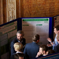 People chatting at an exhibition stand